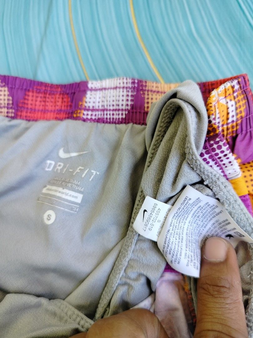 Nike Dri-Fit Running Shorts Size S (Category: Activewear) located in Manila. Submitted by virgiliosa38485 (Listing ID 1464494395, Image 3). Description: - Cute Nike running shorts -Waist 30-40 - Fun polka dot pattern (purple base with pink, yellow, white dots) - Bright yellow and pink trim - Dri-Fit material for comfort and performance - Great for workouts or casual wear - Size: S.