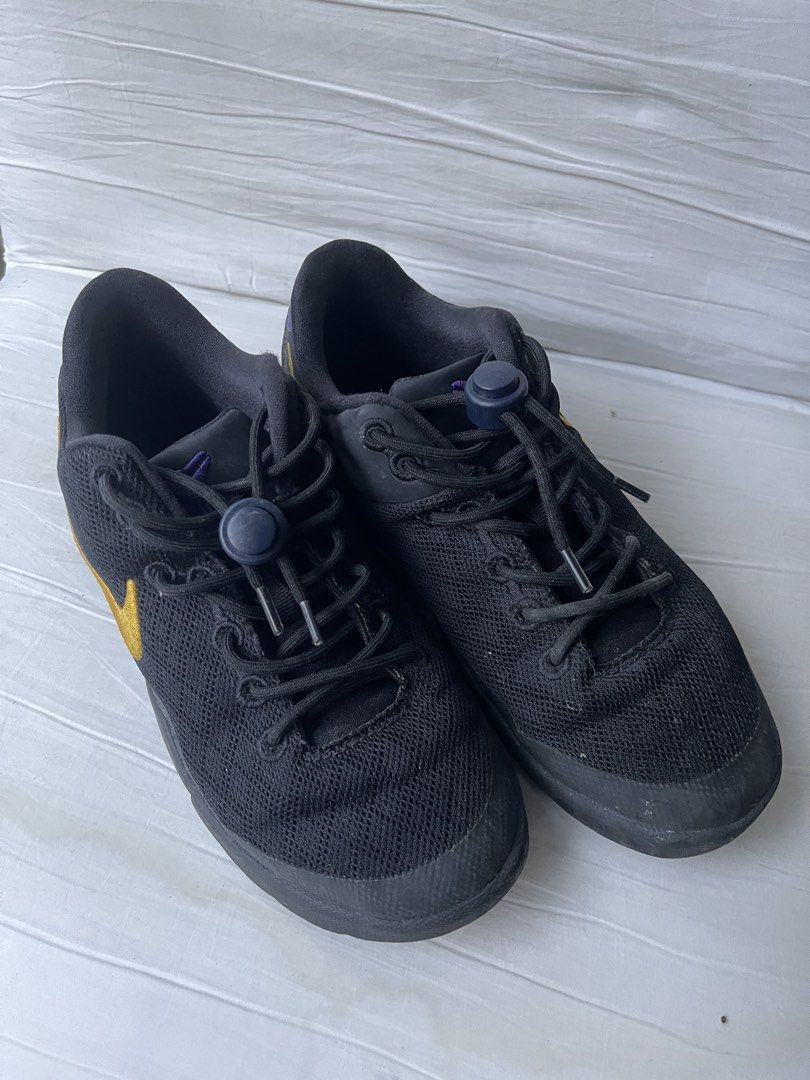 Nike Kobe VIII 2Y (Category: Babies & Kids Fashion) located in Paranaque City. Submitted by smconsul (Listing ID 1464462718, Image 2). Description: - Authentic Nike Kobe Mamba Focus basketball shoes - Color: Black with gold swoosh and purple accents - Closure: Lace-up with toggle - Versatile: Great for basketball or casual wear - Condition: Shows some signs of wear on soles and uppers, but still has plenty of life left Loc: Las Pinas Delivery: j&