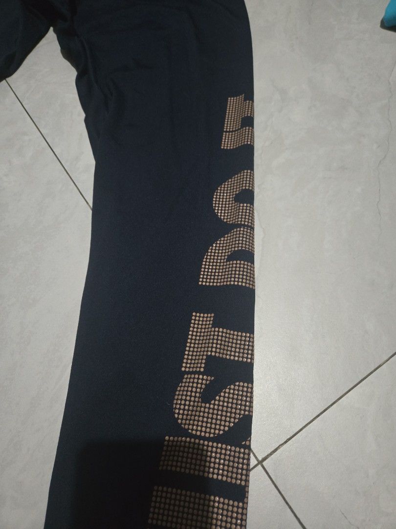 Nike Pro "Just Do It" Leggings (Category: Activewear) located in Pasig City. Submitted by izzy0202 (Listing ID 1464392886, Image 2). Description: - Black Nike Pro leggings - Features 'Just Do It' slogan in a dotted pattern on the side - Ideal for workouts or casual wear - Made with comfortable and stretchy material.
