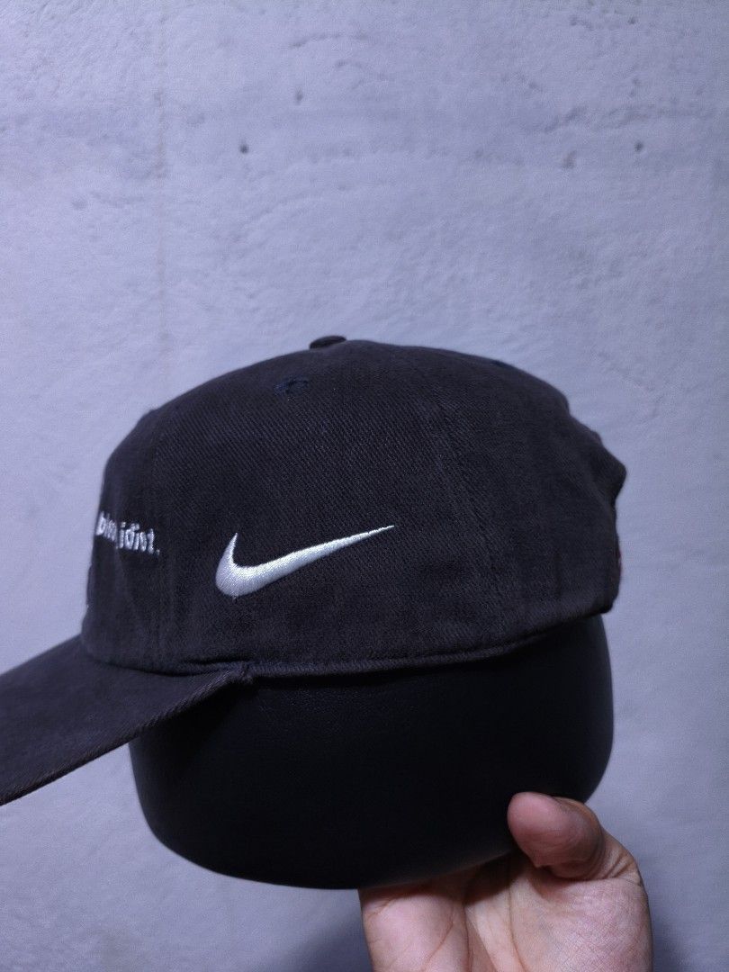Nike Richmond Tigers Y2k cap (Category: Caps & Hats) located in Malilipot. Submitted by aronbigorn96320 (Listing ID 1464489543, Image 3). Description: - Dark grey Nike cap - Embroidered Richmond Tigers logo on front - 'Drink, drive, bloody idiot.' text on sides - Nike swoosh detail - Back tag: 'Engineered to the exact specifications of championship athletes.' - Ideal for Richmond Tigers fans.