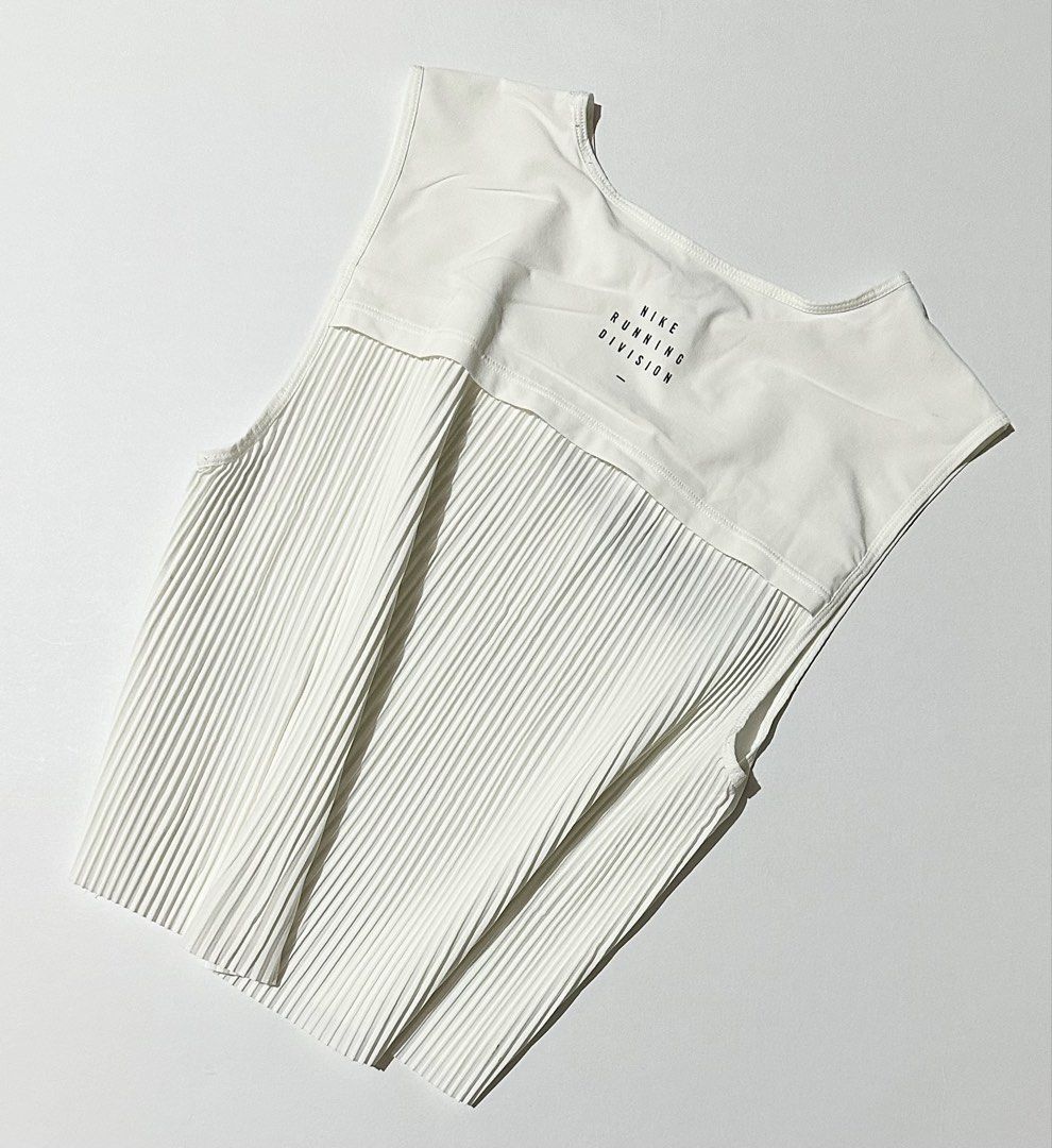 Nike Run Division Pleated Tank (Category: Activewear) located in Manila. Submitted by reclaimed.shop (Listing ID 1464435148, Image 3). Description: Description: A premium Nike Run Division performance tank designed for running and high-intensity training. Its lightweight mixed-media construction combines a smooth athletic fabric with a distinctive micro-pleated lower panel for enhanced airflow and movement. ✔️ Style: Nike W NK Run Division Tank P