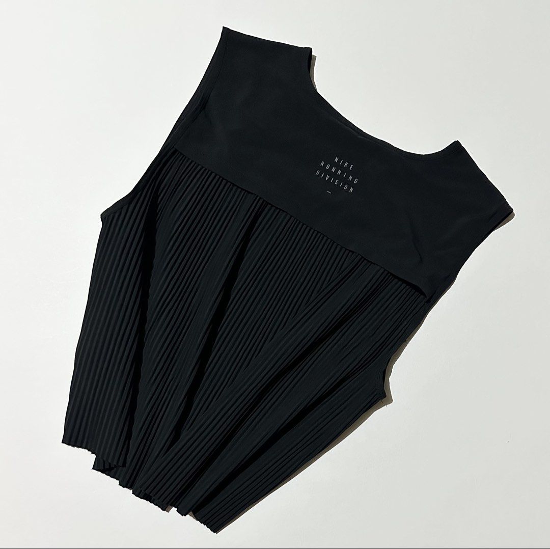 Nike Run Division Pleated Tank (Category: Activewear) located in Manila. Submitted by reclaimed.shop (Listing ID 1464446500, Image 3). Description: Description: A premium Nike Run Division performance tank designed for running and high-intensity training. Its lightweight mixed-media construction combines a smooth athletic fabric with a distinctive micro-pleated lower panel for enhanced airflow and movement. ✔️ Style: Nike W NK Run Division Tank P