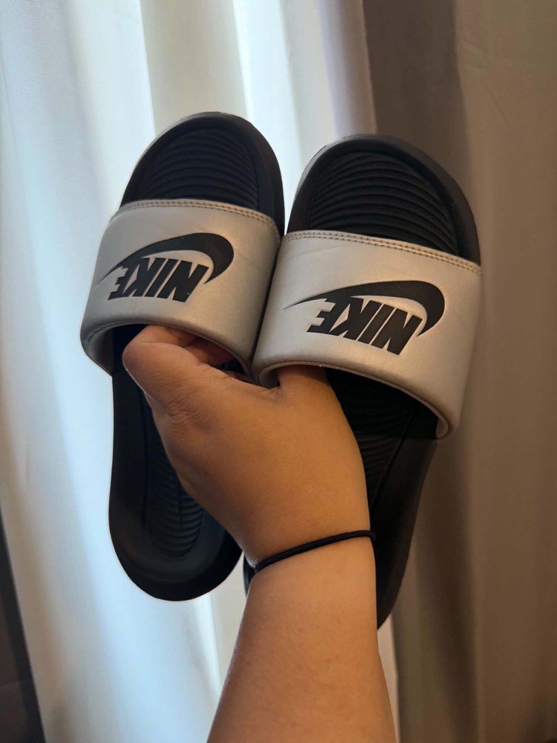 Nike slide (Category: Flats & Sandals) located in Manila. Submitted by perlitas (Listing ID 1464371798, Image 3). Description: 1500 for 2 pairs (with box).