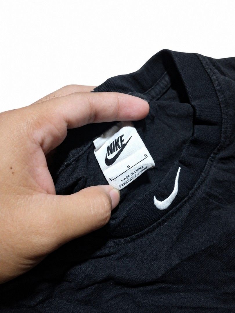 Nike T-SHIRT (Category: Formal Shirts) located in Iligan City. Submitted by jydsale. (Listing ID 1464447506, Image 3). Description: 🖤 NIKE BLACK NECK LOGO 🖤 👕 Original Nike T-shirt ✨ Classic crew neck design 🧵 Embroidered Nike logo detail on the neck 🖤 Clean and simple everyday style 👌 Comfortable and easy to pair with shorts, jeans, or joggers 🎨 Color: Black 📏 Size: L (based on tag) ✅ Good condition, with natural fabric wrinkles 👖 Perfe