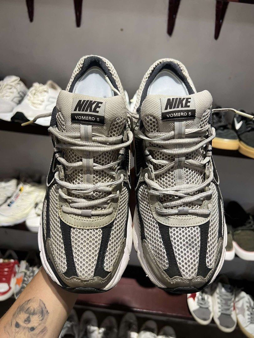 Nike Vomero 5 Running Shoes (Category: Sneakers) located in Bacolod City. Submitted by novymaesel14868 (Listing ID 1464494562, Image 3). Description: - Nike Vomero 5 running shoes - Color: Grey and Black - Features breathable mesh upper - Cushioned sole for excellent comfort - Ideal for running or everyday wear - Shows some signs of wear on soles and uppers.