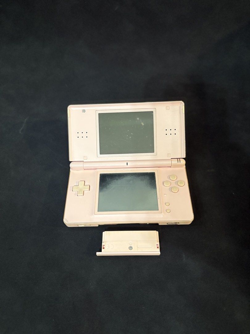Nintendo DS Lite Pink (Category: Nintendo) located in Manila. Submitted by johnnybrav16957 (Listing ID 1464567161, Image 1). Description: Nintendo DS Lite Pink – ₱1,100 Condition: Used / As-is - Bottom screen working - Good buttons and controls - DS game slot working - GBA game slot working - With GBA slot cover - Smooth gameplay - Hinge still functional but may appear flimsy - No charger available - No stylus - Volume not working - Has scratches