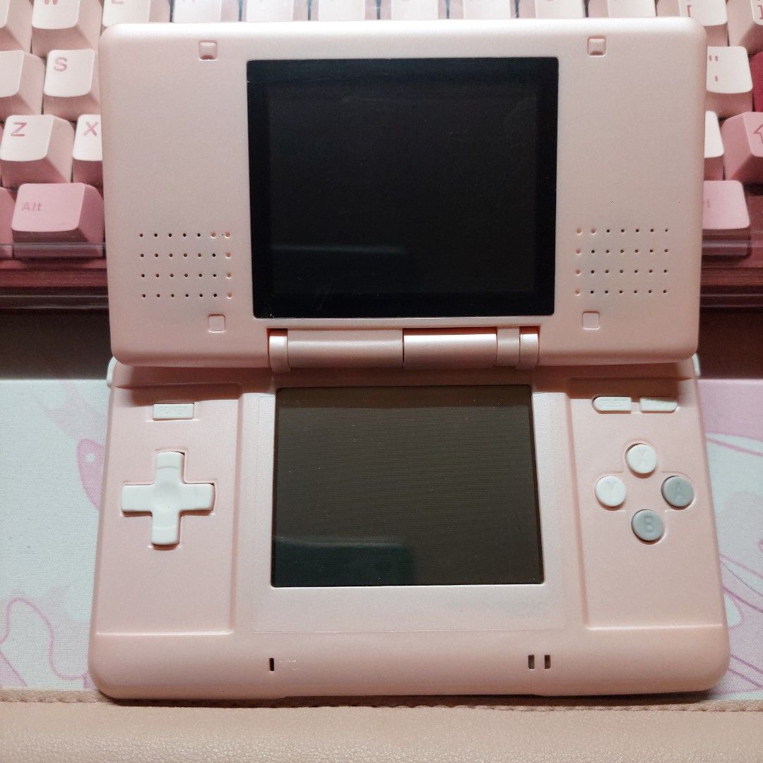 Nintendo DS Phat (Pink) - Reshelled (Category: Nintendo) located in Bulacan. Submitted by piaattos (Listing ID 1464566862, Image 2). Description: Nintendo DS Phat (Pink) - Reshelled (will inlude the original shell!) w/ charger! (not sure if the gba slot is working) MOP: GCASH/MAYA/MARIBANK MOD: GGX, J&T, SDD.