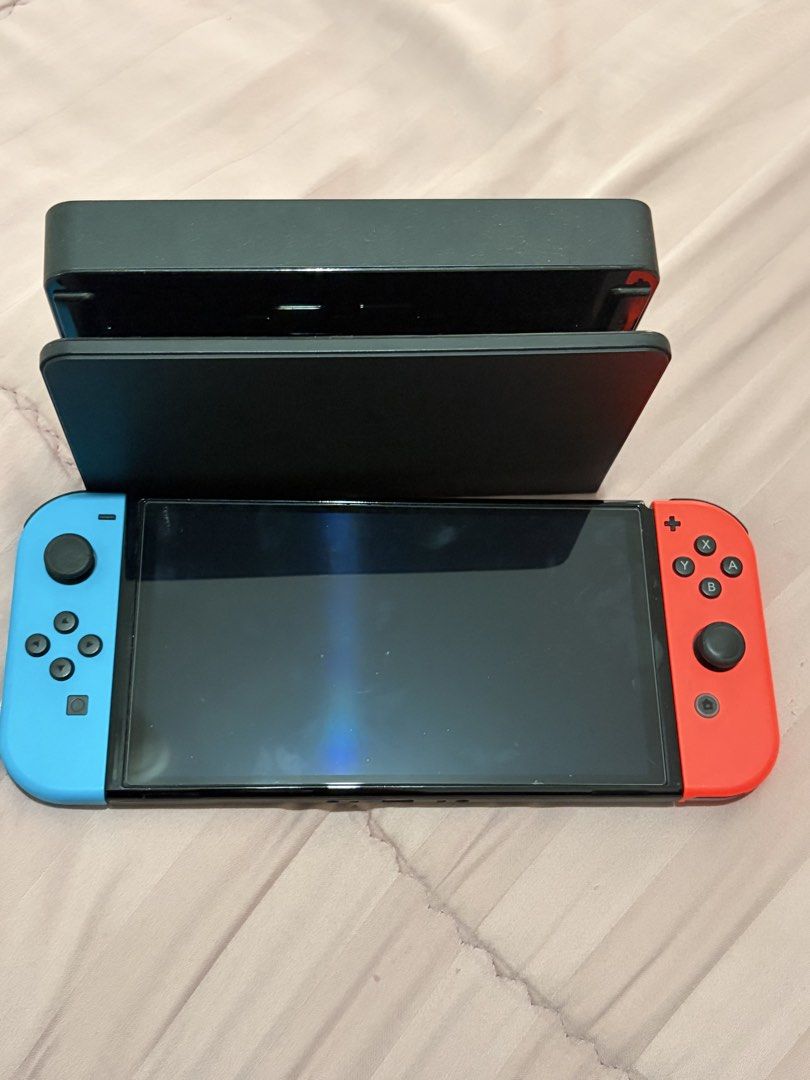 Nintendo switch (Category: Other Gadgets) located in Quezon City. Submitted by smorata (Listing ID 1464447511, Image 1). Description: * Good working condition * Original blue & red Joy-Con controllers * Complete set if dock + charger are included.