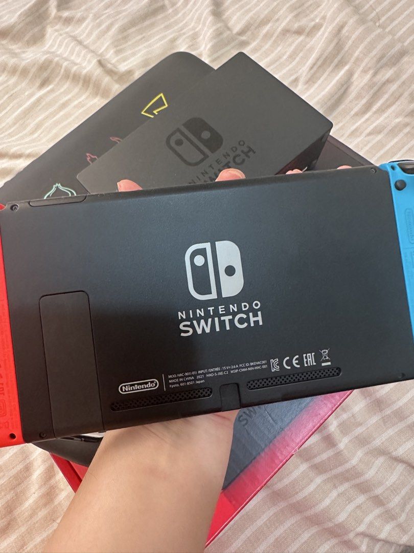 Nintendo Switch (Category: Nintendo) located in Manila. Submitted by biancamarie03 (Listing ID 1464370965, Image 3). Description: - Nintendo Switch Console - Original Joy-Cons included - Official Dock for TV play - Special Edition Pokemon Anniversary Case - All Original Packaging - Versatile: Play at home or on the go - Ideal for any gamer.