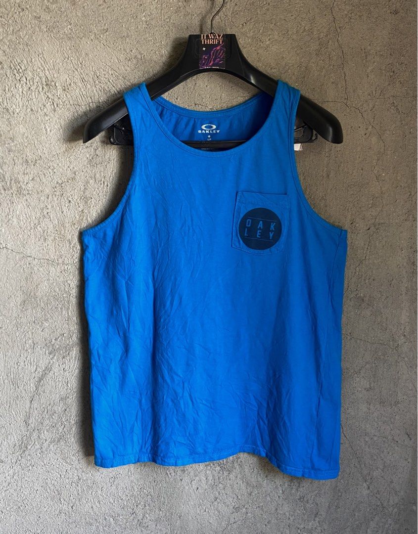 Oakley Blue Tank Top - Size S/P (Category: Sleeveless) located in Dipolog. Submitted by wazienwathskin (Listing ID 1464383359, Image 1). Description: - Blue Oakley tank top - 100% Cotton - Small chest pocket with Oakley logo - Regular fit - Ideal for casual wear or workouts.
