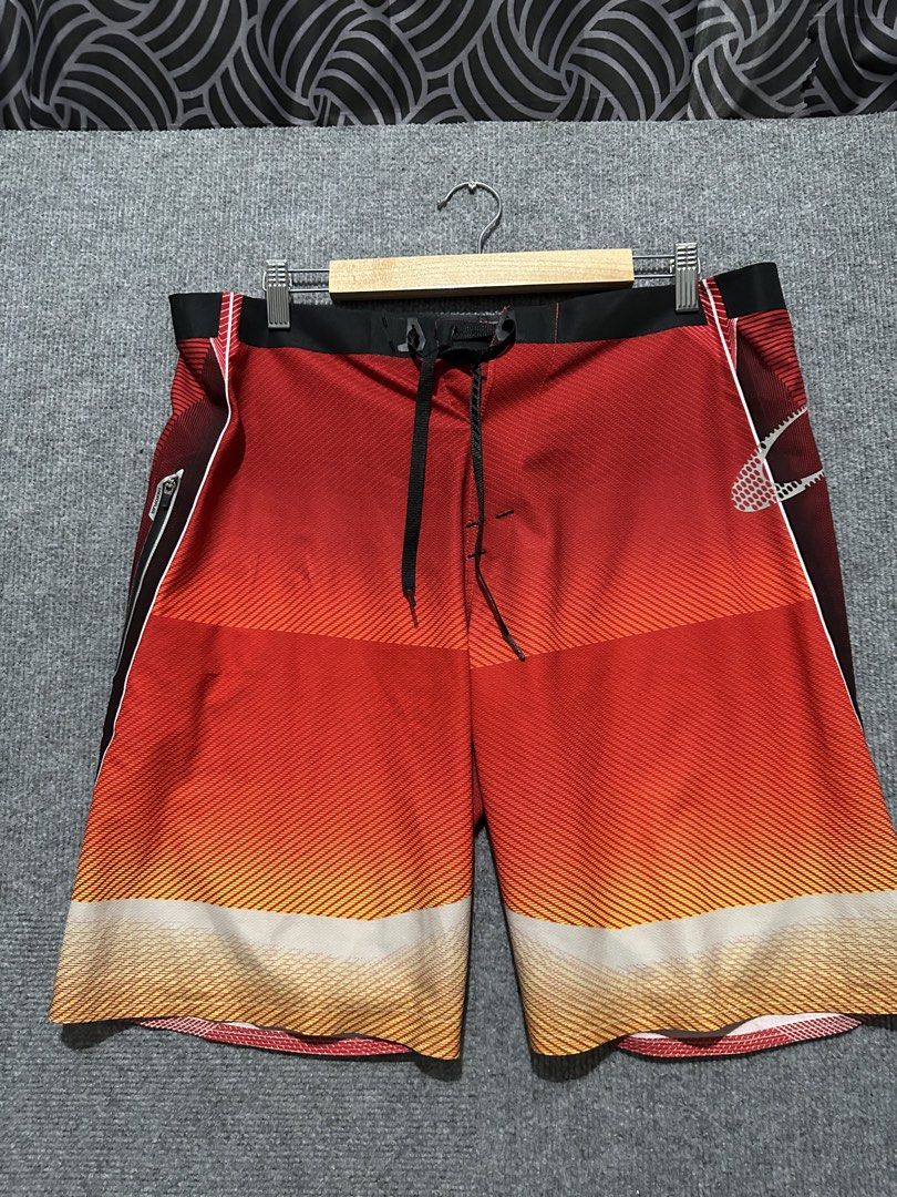 Oakley Board Shorts Red Gradient Pattern (Category: Swim Trunks & Board Shorts) located in Villasis. Submitted by justinramosonfb (Listing ID 1464470504, Image 3). Description: - Cool red gradient design - Features Oakley logo on side and back - Drawstring waist for adjustable fit - Ideal for swimming, lounging, or your next beach adventure.