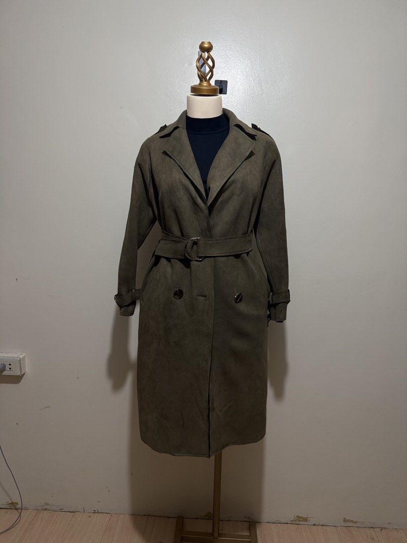 Olive Green Suede Belted Trench Coat (Category: Coats, Jackets and Outerwear) located in Lingayen. Submitted by eunicavena68844 (Listing ID 1464492394, Image 3). Description: Olive green trench coat with belt, double-breasted buttons & adjustable cuffs. Suede-like finish. Wore this in Taiwan and still in good condition. Perfect for cold-weather trips / classy OOTDs..