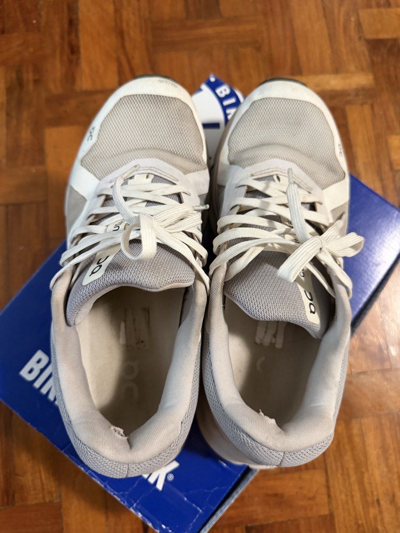On Cloud Running Shoes (Category: Sneakers) located in Paranaque City. Submitted by ferrewr (Listing ID 1464410868, Image 2). Description: - Grey and white On Cloud running shoes - Breathable mesh upper - Unique sole design for excellent cushioning - Minor signs of wear on insoles and soles .