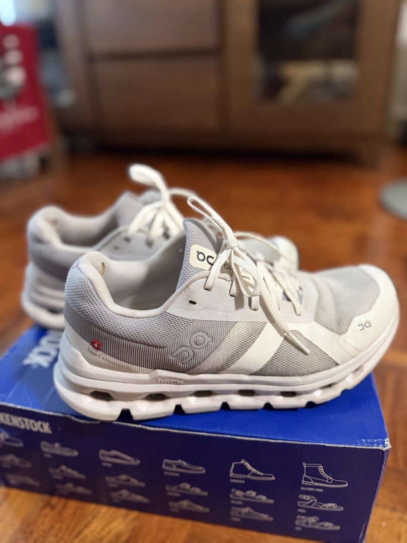 On Cloud Running Shoes (Category: Sneakers) located in Paranaque City. Submitted by ferrewr (Listing ID 1464410868, Image 1). Description: - Grey and white On Cloud running shoes - Breathable mesh upper - Unique sole design for excellent cushioning - Minor signs of wear on insoles and soles .