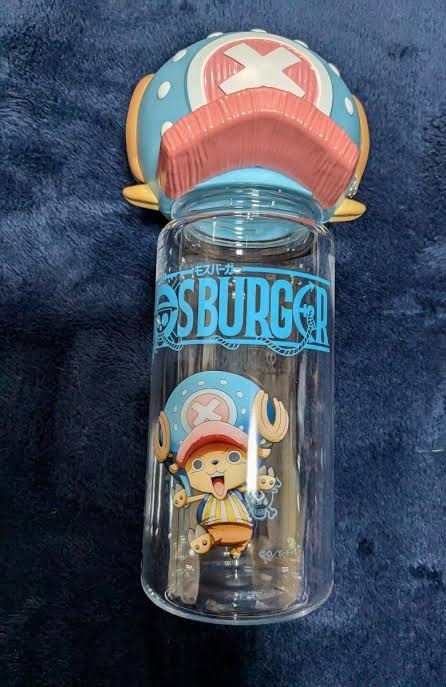 One Piece Mos Burger Chopper Water Bottle (Category: Water Bottles & Tumblers) located in Valenzuela. Submitted by sel000 (Listing ID 1464445080, Image 3). Description: - Officially licensed One Piece merchandise - Features a unique Tony Tony Chopper hat-shaped cap - Mos Burger collaboration design - Clear plastic bottle with blue print - Ideal for drinks on the go - Perfect gift for One Piece fans.