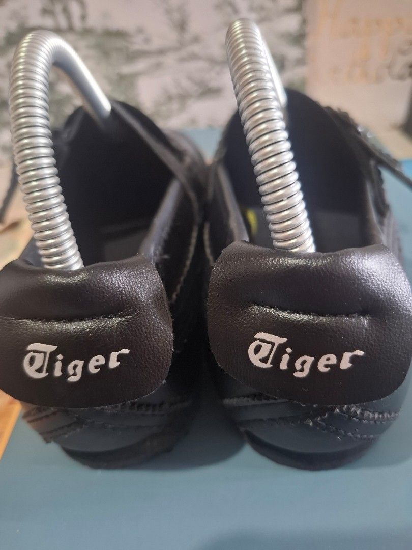 Onitsuka Tiger Black Mary Jane Shoes (Category: Flats & Sandals) located in Marikina City. Submitted by bags21.ph (Listing ID 1464370249, Image 1). Description: - Brand: Onitsuka Tiger - Color: Black - Style: Mary Jane - Features: Two buckle straps, scalloped trim - Includes: Shoe trees - Origin: Made in Vietnam.