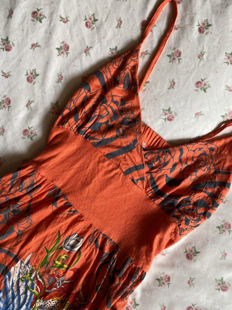 Orange Floral Print Spaghetti Strap Mini Dress (Category: Dresses) located in Iloilo. Submitted by kumiyuiz (Listing ID 1464493346, Image 2). Description: - Vibrant orange mini dress - Unique floral and wing print - Flattering empire waist - Adjustable spaghetti straps - Comfortable fabric with slight stretch - Ideal for casual outings or beach days.