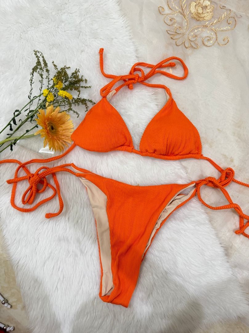 Orange Self Tie Two Piece Swimsuit (Category: Bikinis & Swimsuits) located in Mandaluyong City. Submitted by prelovedbyrinoa_ (Listing ID 1464358345, Image 1). Description: Cute and versatile swimsuit, perfect for beach days, pool trips, and vacations! 🌴✨ • Padded cups • Stylish & comfy fit • Brand New • Good condition.