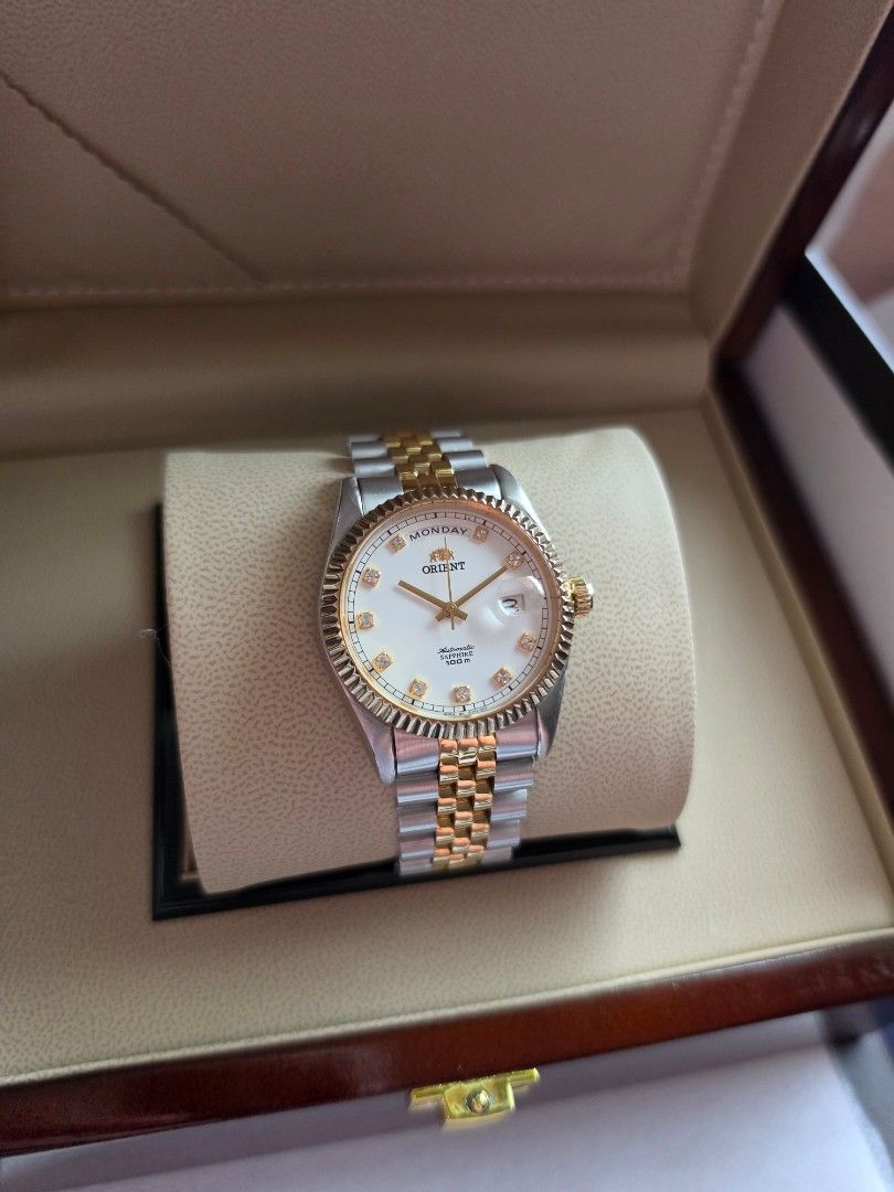 Orient President Day-Date Sapphire Two-Tone White Dial (Category: Men's Watches) located in Quezon City. Submitted by imchanggy (Listing ID 1464458354, Image 3). Description: Orient President Day-Date Sapphire Two-Tone White Dial EV0J002C ➡️Php 30,800 *Rare, and discontinued model *Newly Serviced movement *All original parts with the signature two-tone steel and gold-plated jubilee bracelet *Fluted bezel with clear crystal indices on a white enam