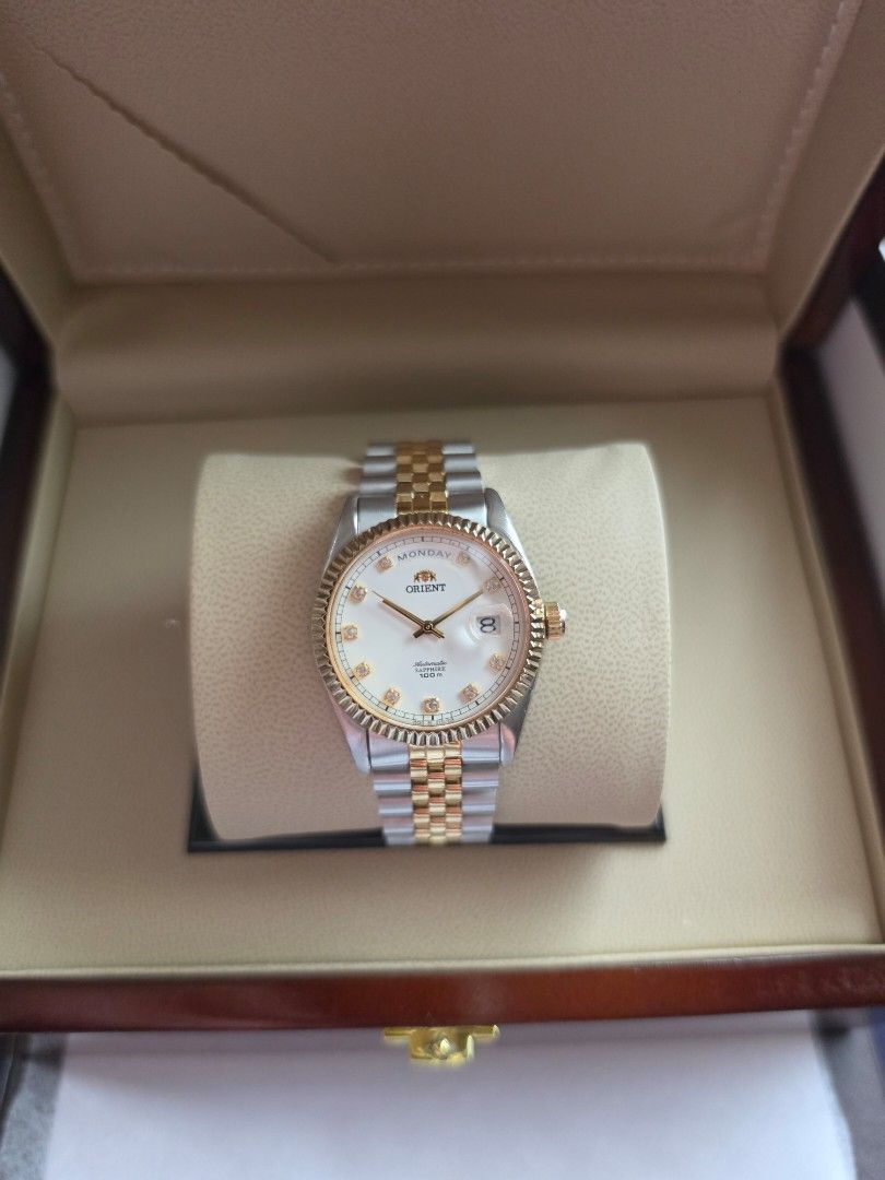 Orient President Day-Date Sapphire Two-Tone White Dial (Category: Men's Watches) located in Quezon City. Submitted by imchanggy (Listing ID 1464458354, Image 2). Description: Orient President Day-Date Sapphire Two-Tone White Dial EV0J002C ➡️Php 30,800 *Rare, and discontinued model *Newly Serviced movement *All original parts with the signature two-tone steel and gold-plated jubilee bracelet *Fluted bezel with clear crystal indices on a white enam