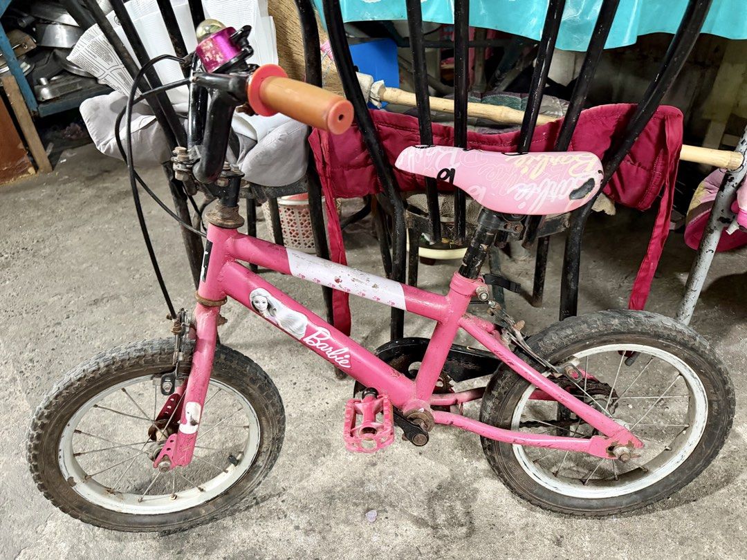 Original Barbie Kids Bicycle (Category: Bicycles) located in Valenzuela. Submitted by boutiquechic (Listing ID 1464369830, Image 1). Description: - Pink Barbie bicycle for kids - Features a working bell on the handlebar - Pink seat with Barbie branding - Tires have some wear, suitable for learning - Ready for its next rider!.