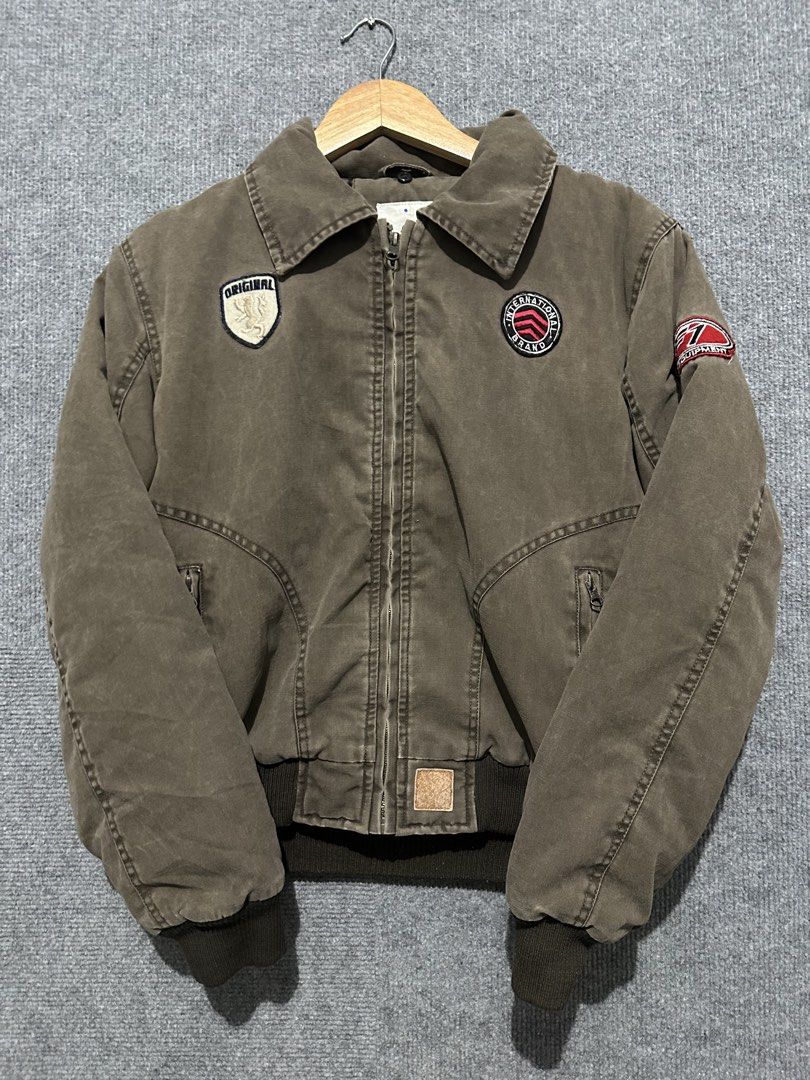 Original Brand Bomber Jacket (Category: Coats, Jackets and Outerwear) located in Villasis. Submitted by justinramosonfb (Listing ID 1464508054, Image 1). Description: - Stylish brown bomber jacket with unique patches. - Front zipper closure for easy wear. - Ribbed cuffs and hem for a comfortable fit. - Soft inner lining for added comfort. - Ideal for everyday casual styling..