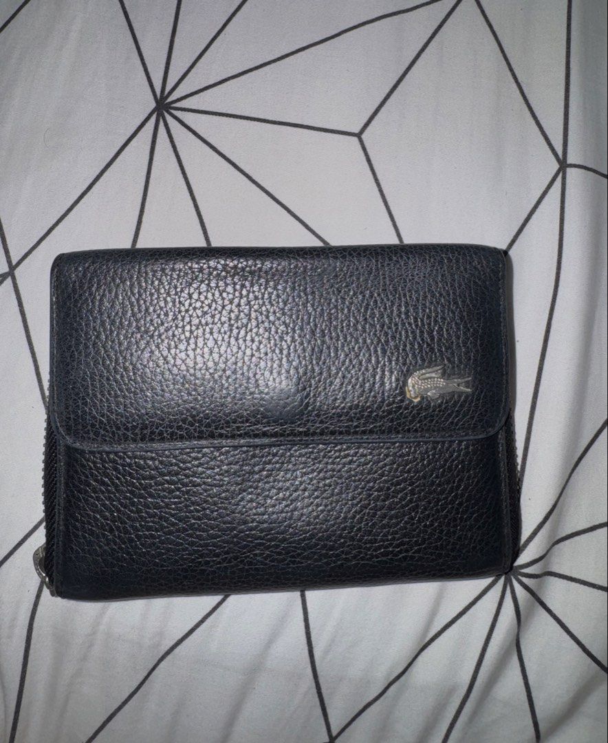 Authentic Lacoste Black Wallet (Category: Luxury Bags & Wallets) located in Mandaluyong City. Submitted by isseysimona (Listing ID 1464414006, Image 1). Description: Original Price: 6,000 PHP Issue: The handle got lost but the wallet's leather is still intact. Bought from Lacoste Glorietta..