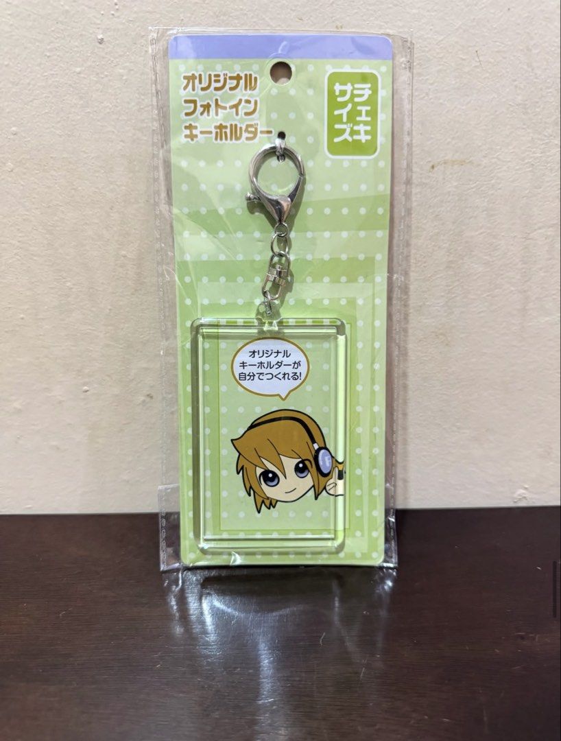 Original Photo Keychain with Anime Character (Category: Character Goods) located in Pasig City. Submitted by boredtakoyaki (Listing ID 1464375754, Image 1). Description: - Cute anime character design - Original photo keychain: insert your own picture! - Durable metal clasp and ring - Ideal for attaching to bags or keys - Authentic Sarai-Tsuki product - Great gift for anime fans and accessory lovers.