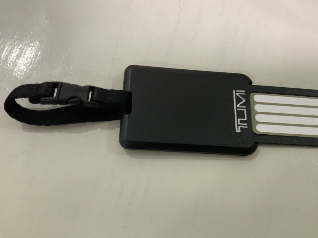 Original Tumi Black Luggage Tag with Strap and Insert (Category: Luggage) located in San Fernando. Submitted by destinydeals04 (Listing ID 1464568409, Image 3). Description: - Original tumi Genuine plastic Black Tumi luggage tag - Features a secure strap and buckle for easy attachment - Convenient slide-out insert for your contact information - Made from durable, travel-ready material - Essential for keeping your luggage easily identifiable Excel