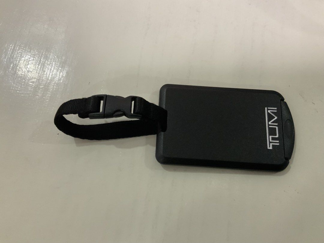 Original Tumi Black Luggage Tag with Strap and Insert (Category: Luggage) located in San Fernando. Submitted by destinydeals04 (Listing ID 1464568409, Image 2). Description: - Original tumi Genuine plastic Black Tumi luggage tag - Features a secure strap and buckle for easy attachment - Convenient slide-out insert for your contact information - Made from durable, travel-ready material - Essential for keeping your luggage easily identifiable Excel