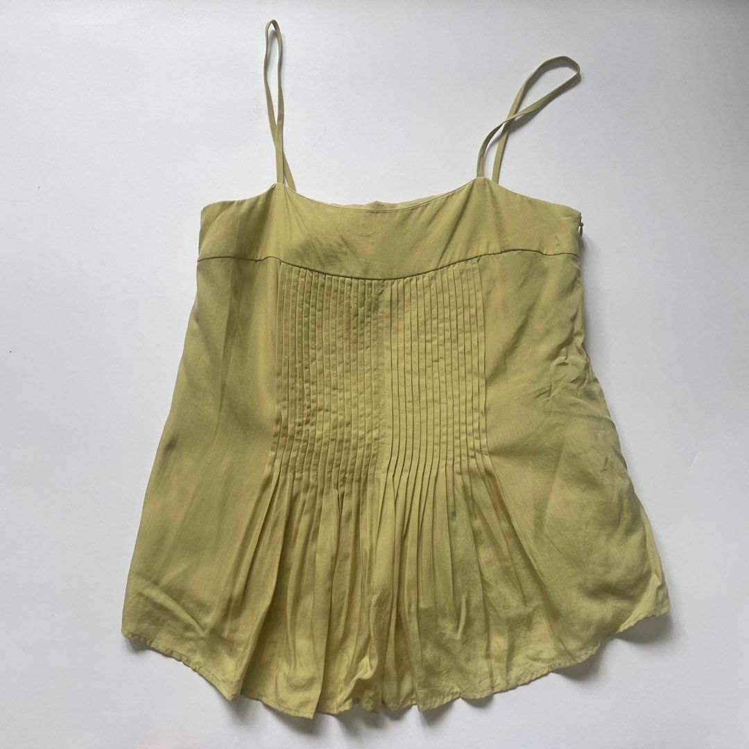 Our Second Nature Pleated Camisole Top (Category: Sleeveless) located in Pasay City. Submitted by lovedbyzea (Listing ID 1464418867, Image 1). Description: - Brand: Our Second Nature - Color: Light Yellow - Style: Camisole Top - Features: Delicate pleats down the front, spaghetti straps, side zipper closure - Size: XS - Versatile: Great for layering or wearing on its own.