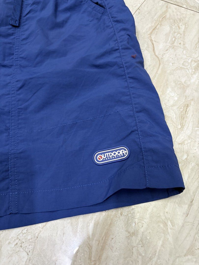Outdoor Athletic blue nylon shorts (Category: Babies & Kids Fashion) located in General Santos City (Dadiangas). Submitted by a.rt.eyes (Listing ID 1464546770, Image 3). Description: Size 165 on tag actual waistline 24-26 stretchable Size small for adult Length 17 Leg opening 11 Excellent condition with no issues Color rate 10/10 Authentic Located in General Santos City, Mindanao. Shipping fee applies for buyers outside my location. Payment first