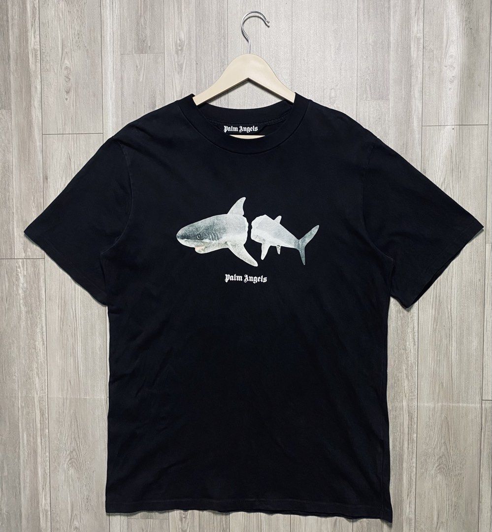 PALM ANGELS SHARK GRAPHIC TEE - BLACK (Category: Tshirts & Polo Shirts ) located in Manila. Submitted by ztfirtfritz (Listing ID 1464446778, Image 1). Description: PALM ANGELS SHARK GRAPHIC TEE - BLACK LEGIT/OFF COMPLETE TAGS LARGE MEASUREMENTS” SHOULDER: 20 SLEEVE: 10.5 PIT: 22 LENGTH: 31 EXCELLENT 400 + SF.