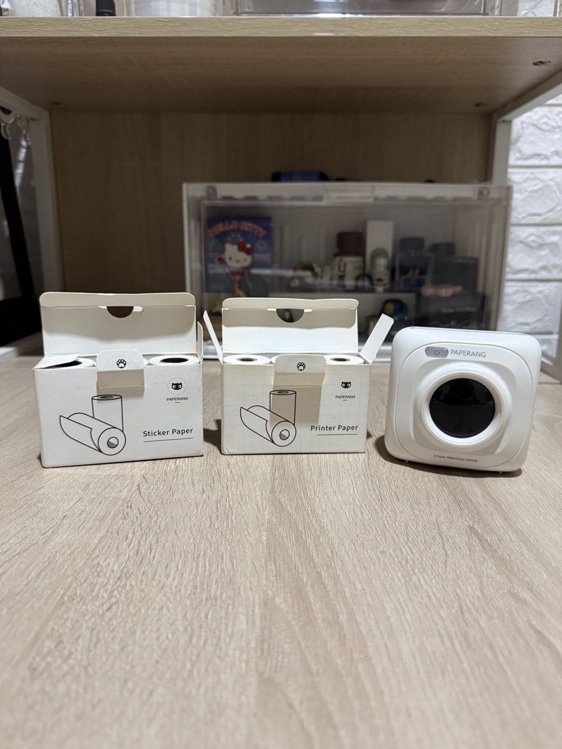 PAPERANG Printer with Sticker and Printer Paper Rolls (Category: Printers, Scanners & Copiers) located in Pasig City. Submitted by boredtakoyaki (Listing ID 1464499400, Image 1). Description: - PAPERANG printer for sale - Includes 1 box of sticker paper (multiple rolls) - Includes 1 box of printer paper (multiple rolls) - Ideal for journaling, labeling, and printing small notes - Compact and easy to use - Great for on-the-go printing - Charging w