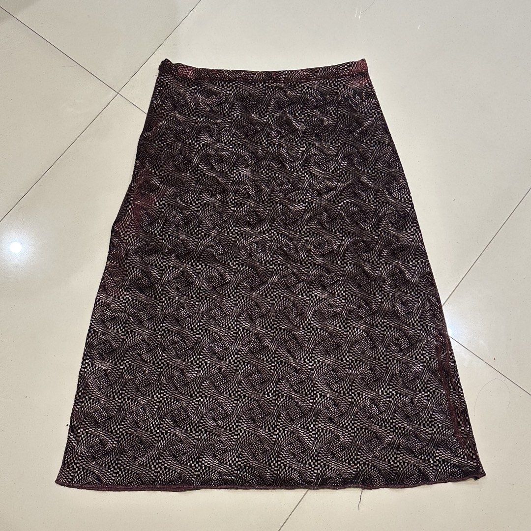 Patterned Velvet Midi Skirt (Category: Skirts) located in Manila. Submitted by filoved__ (Listing ID 1464443678, Image 1). Description: - Brand: Bishop Devinette - Has a side zipper enclosure and button - [Measurements in inches] Waist: 27-29, Length: 25 - Slight flaw by the zipper, can be repaired - Stretchy and flowy at the ends but more of a pencil skirt silhouette - Color is a darker burgundy in real life - Can also be styled as a mini dress!