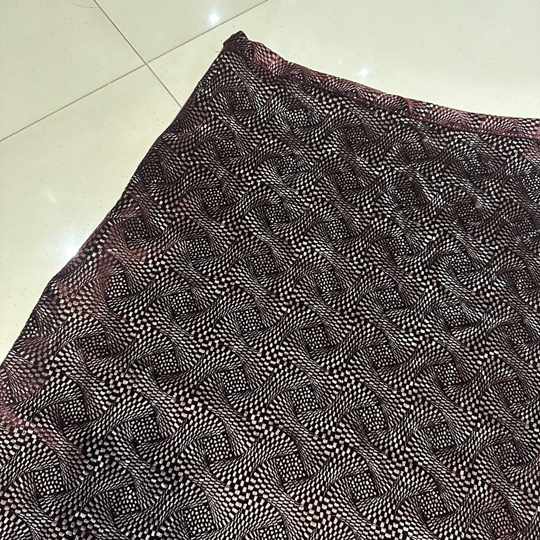Patterned Velvet Midi Skirt (Category: Skirts) located in Manila. Submitted by filoved__ (Listing ID 1464443678, Image 2). Description: - Brand: Bishop Devinette - Has a side zipper enclosure and button - [Measurements in inches] Waist: 27-29, Length: 25 - Slight flaw by the zipper, can be repaired - Stretchy and flowy at the ends but more of a pencil skirt silhouette - Color is a darker burgundy in real life - Can also be styled as a mini dress!
