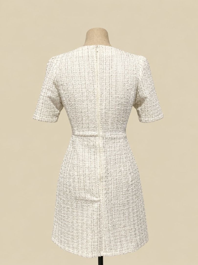 Pearl Tweed Mini Dress (Category: Dresses) located in Angeles City. Submitted by thebeehivecloset (Listing ID 1464490467, Image 2). Description: Elegant ivory tweed mini dress featuring pearl-accented buttons, front flap pockets, short sleeves, and a flattering fitted silhouette. Perfect for a classy and feminine look..