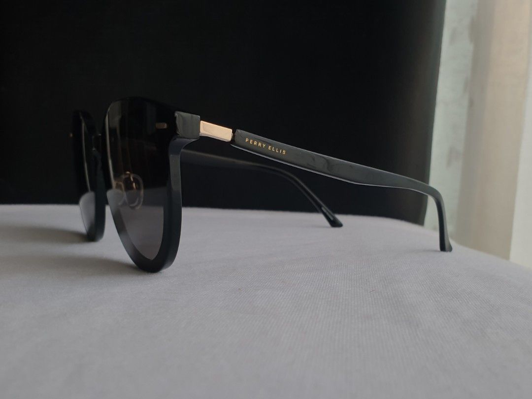Perry Ellis Sunglasses (Category: Sunglasses & Eyewear) located in Quezon City. Submitted by WasalakTwo (Listing ID 1464462412, Image 3). Description: Bought in Japan High quality Goodcondition Clean and presentable Open for delivery nationwide.