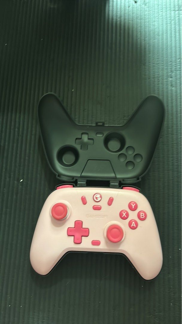 Pink GameSir T4 Pro Controller with Case (Category: Controllers) located in Caloocan City. Submitted by harveeeydc46927 (Listing ID 1464377810, Image 1). Description: - Pink GameSir T4 Pro controller - Includes original black carrying case - Features pink buttons and a light pink body - Fully functional and ready for your next game.