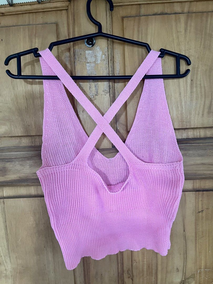 Pink Knitted Criss-Cross Back Crop Top (Category: Sleeveless) located in Manila. Submitted by _ReynGoAway (Listing ID 1464391979, Image 3). Description: - Pink knitted crop top - V-neckline - Criss-cross detail on the back - Stretchy material - Fits XS to S - No issues found - Pick-up in Makati.