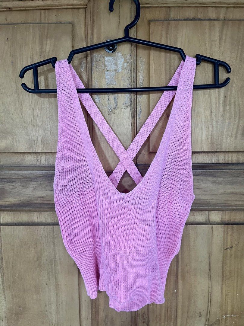 Pink Knitted Criss-Cross Back Crop Top (Category: Sleeveless) located in Manila. Submitted by _ReynGoAway (Listing ID 1464391979, Image 2). Description: - Pink knitted crop top - V-neckline - Criss-cross detail on the back - Stretchy material - Fits XS to S - No issues found - Pick-up in Makati.