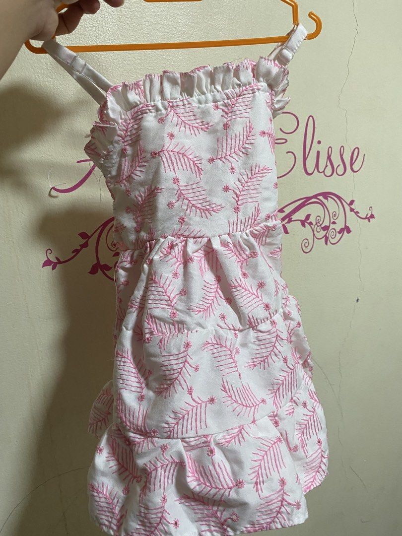 Pink Leaf Print Pet Dress with Ruffles (Category: Babies & Kids Fashion) located in Manila. Submitted by chingsenallertse (Listing ID 1464433809, Image 1). Description: - Cute pink and white pet dress - Features a lovely leaf print all over - Ruffled neckline and hem for extra flair - Ties at the back with a sweet bow - Adorable for your furry friend - Great for everyday walks or special occasions.