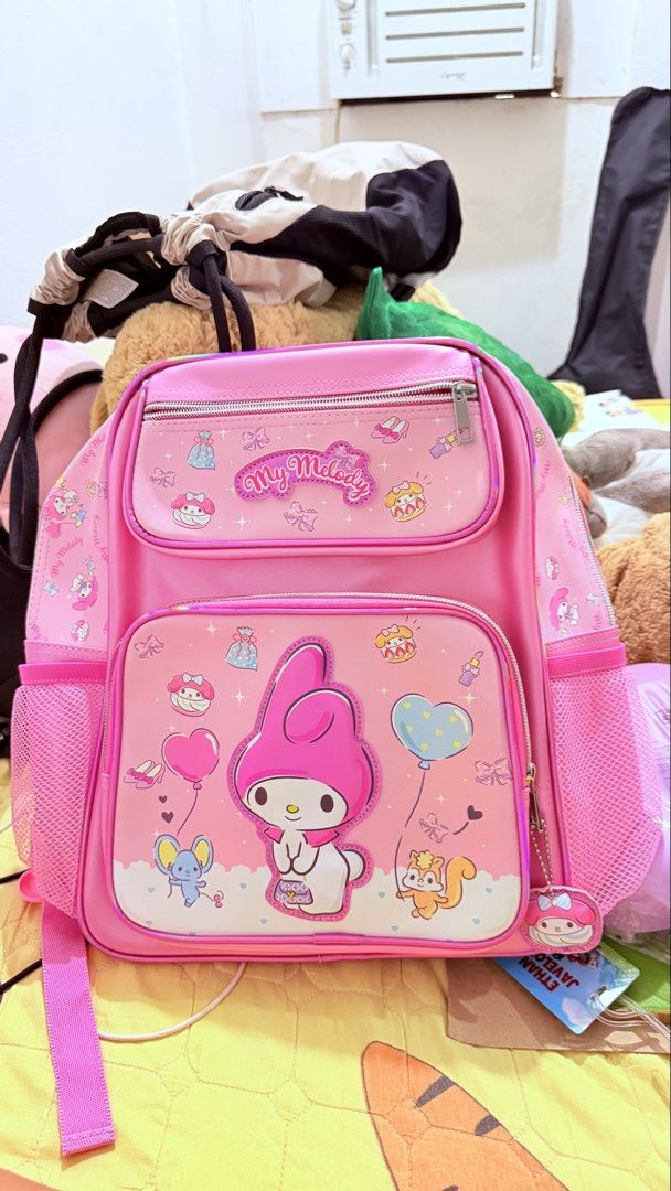 Pink My Melody Backpack (Category: Backpacks) located in San Juan City. Submitted by lexie_sky (Listing ID 1464397531, Image 1). Description: - Unused, like new - Adorable pink backpack with all-over My Melody graphics. - Multiple compartments for organization. - Convenient side mesh pockets for water bottles. - Adjustable straps with My Melody pattern. - Includes a small My Melody charm. - Ideal for school, travel, or everyday adventures..