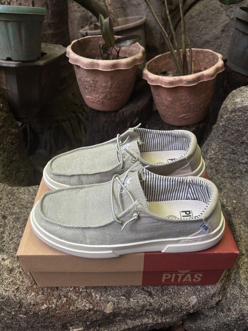 Pitas Slip-on Shoes Size 39 (Category: Flats & Sandals) located in Quezon City. Submitted by yumidltrr117 (Listing ID 1464359304, Image 1). Description: - Verde Pitas slip-on shoes - Size 39 - Canvas upper with rubber sole - Comes with original box - Features slogan 'Walk free, walk in Pitas.' - Ideal for daily use and casual outings.