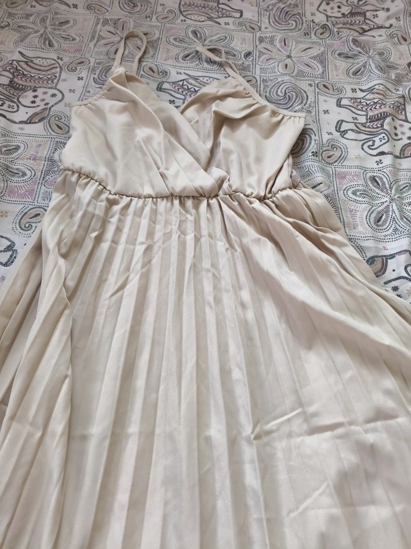 Pleated Maxi Dress with Spaghetti Straps (Category: Dresses) located in Tanay. Submitted by thegoodseed (Listing ID 1464379232, Image 2). Description: - Light beige pleated maxi dress - Spaghetti straps and V-neckline - Comfortable elasticated waist - Flowy skirt - Versatile: dress up for events or down for casual outings.