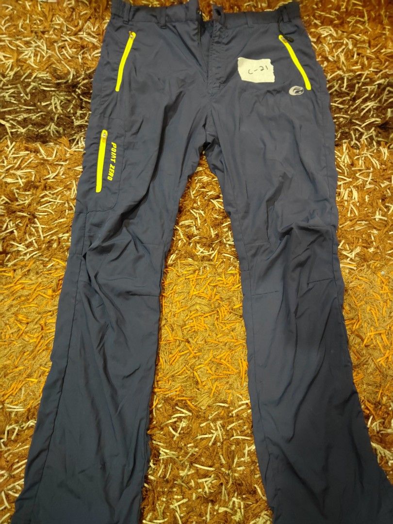 Point Zero Hiking Pants (Category: Trousers) located in Siliau. Submitted by faris9404 (Listing ID 1464460708, Image 1). Description: - Dark grey outdoor/hiking pants -W:38inch,L:41.5inch - Comfortable elastic waistband - Unique yellow zipper detail on back pocket - Slightly flared legs for a modern look - Ideal for active wear and outdoor adventures.