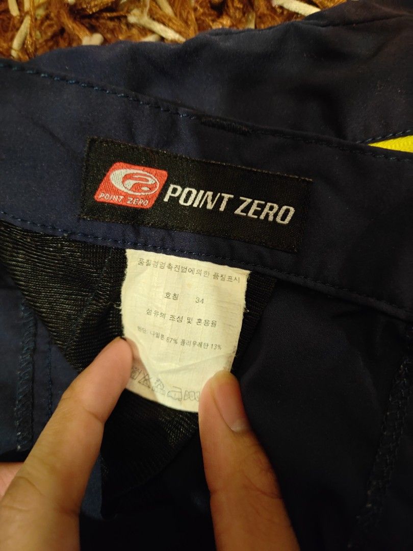 Point Zero Hiking Pants (Category: Trousers) located in Siliau. Submitted by faris9404 (Listing ID 1464460708, Image 2). Description: - Dark grey outdoor/hiking pants -W:38inch,L:41.5inch - Comfortable elastic waistband - Unique yellow zipper detail on back pocket - Slightly flared legs for a modern look - Ideal for active wear and outdoor adventures.