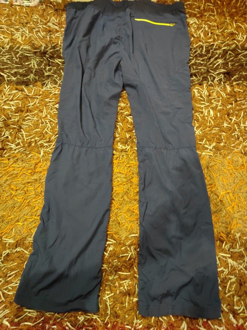 Point Zero Hiking Pants (Category: Trousers) located in Siliau. Submitted by faris9404 (Listing ID 1464460708, Image 3). Description: - Dark grey outdoor/hiking pants -W:38inch,L:41.5inch - Comfortable elastic waistband - Unique yellow zipper detail on back pocket - Slightly flared legs for a modern look - Ideal for active wear and outdoor adventures.