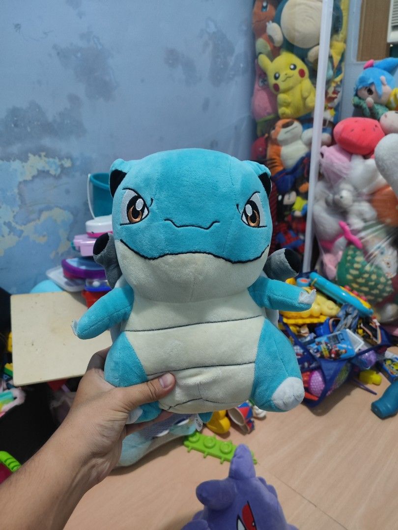 Pokemon Blastoise Plush Toy (Category: Plushies & Soft Toys) located in Iligan City. Submitted by sneakymagician (Listing ID 1464431796, Image 1). Description: - Adorable Blastoise plush toy - Soft and cuddly material - Ideal for Pokemon enthusiasts - Suitable for display or playtime - Looking for a new loving home.