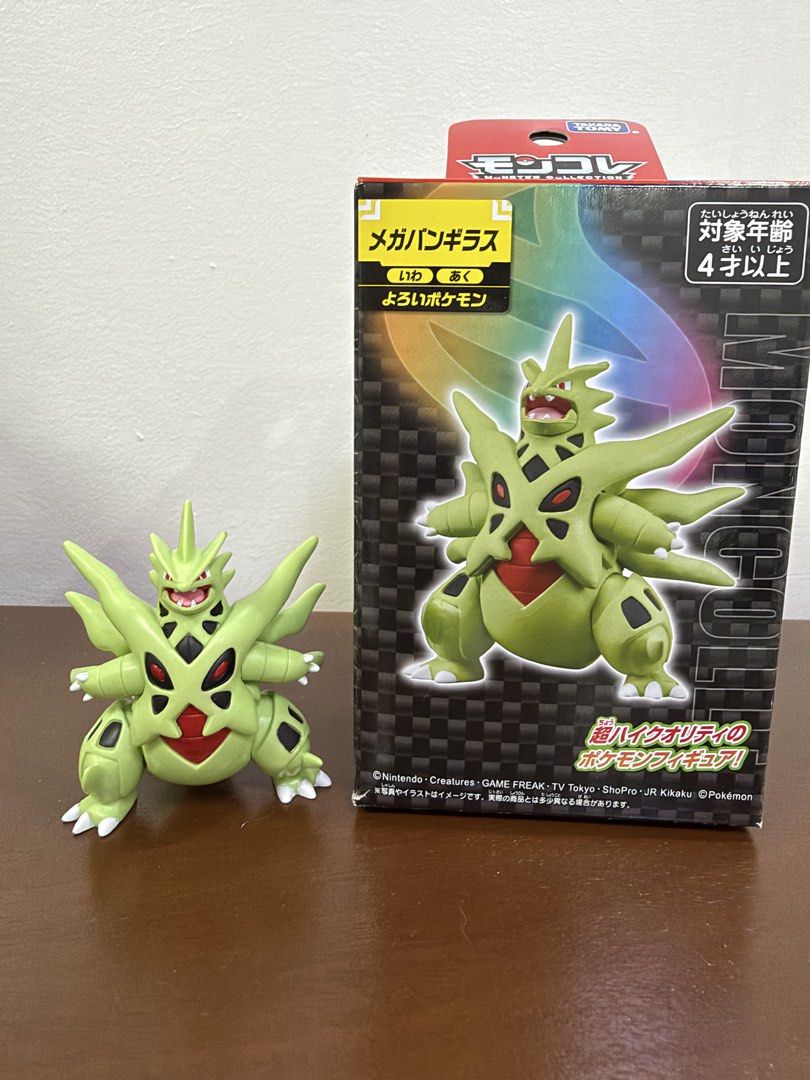 Pokemon Mega Tyranitar Figure (Category: Figurines & Statues) located in Quezon City. Submitted by Ragnarokk (Listing ID 1464502892, Image 1). Description: - Mega Tyranitar Pokemon Figure - Includes Original Box - Color: Green with Red and Black Accents - Condition: Figure looks good, box shows some wear - Ideal for Pokemon collectors and fans.